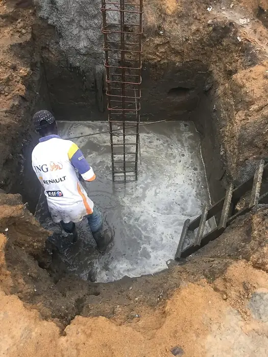 Clifton Group site engineer finishing a concrete footing
